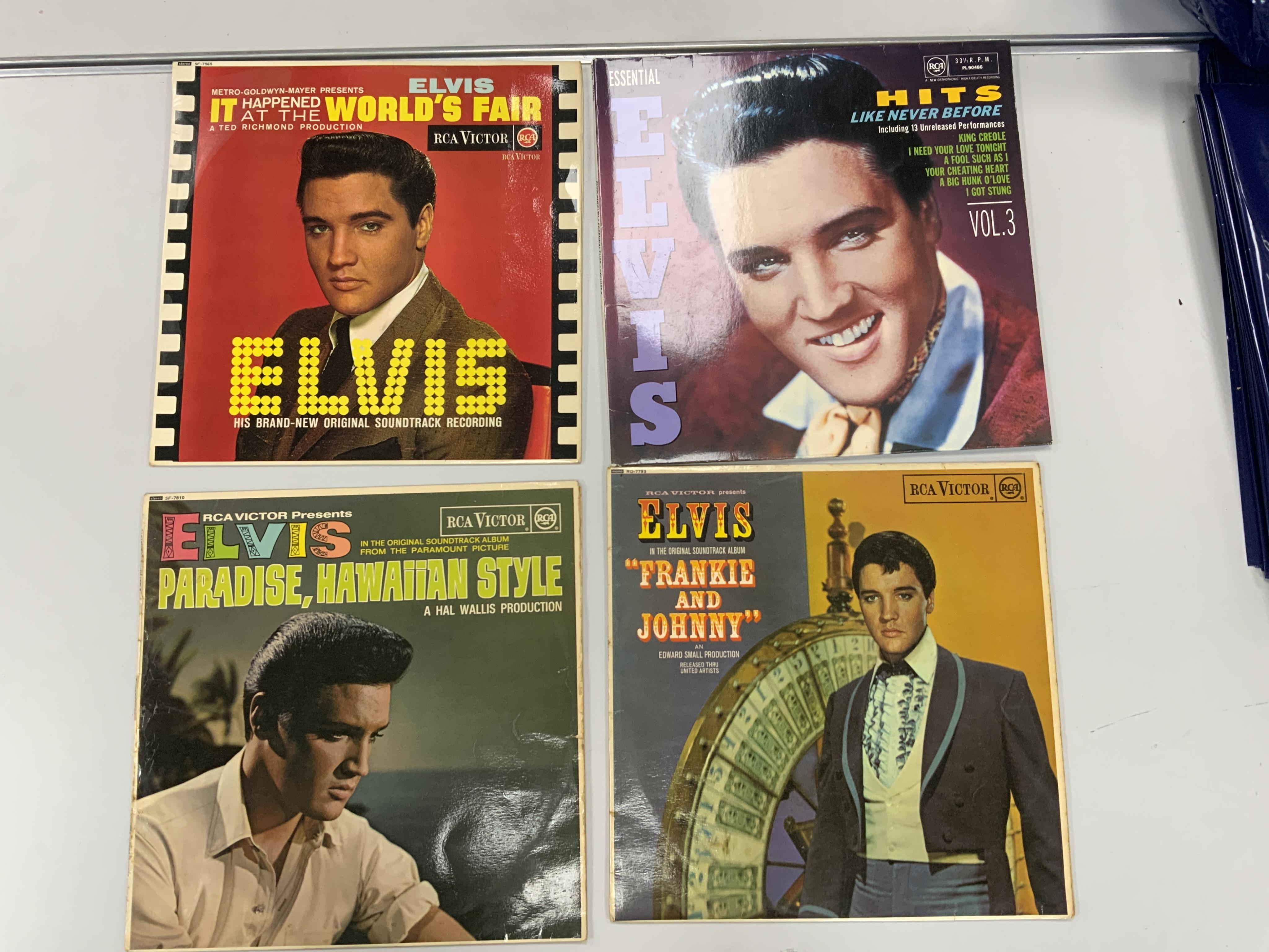 Sixteen Elvis Presley LP record albums including; It Happened at the World’s Fair, Paradise Hawaiian Style, Elvis’ Golden Records, Blue Hawaii, Loving You, California Holiday, Kissin’ Cousins, etc. Condition - fair to go